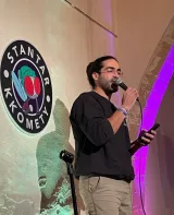 Harambe performing stand-up on a Stantar Kkomety stage
